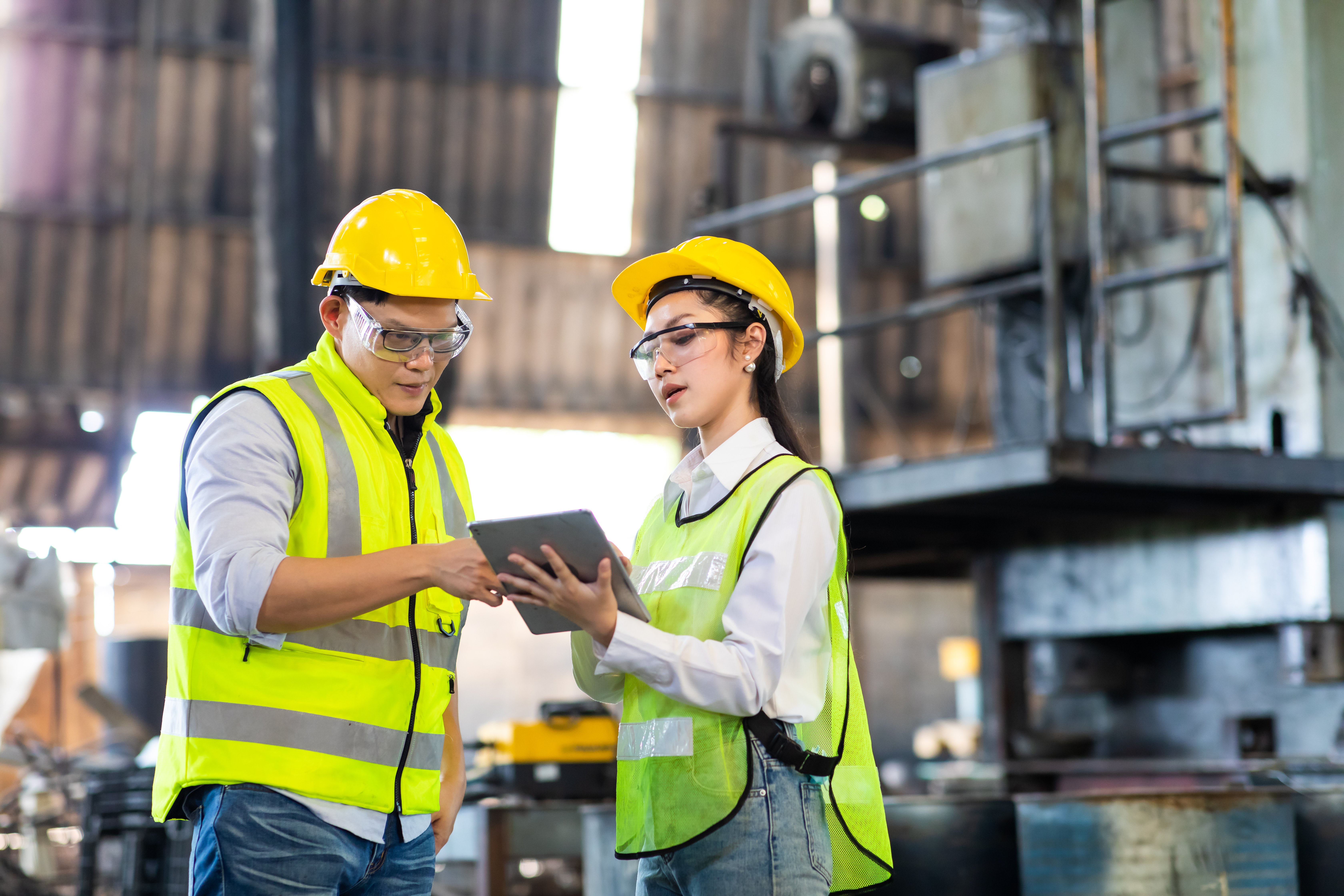 Two meat packing facility members reviewing their HACCP plan