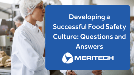 Two food processing employees discuss food safety culture