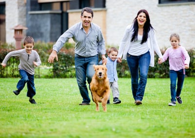 Family running with dog that is healthy thanks to the manufacturer using Meritech automated hygiene for safe pet food 