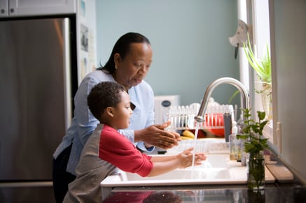 Woman teaching child hand health