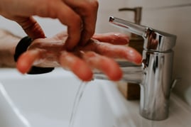 Hands washing in sink