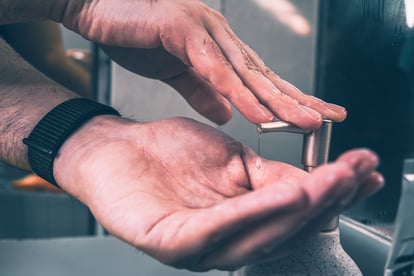 Hands pumping soap dispenser 