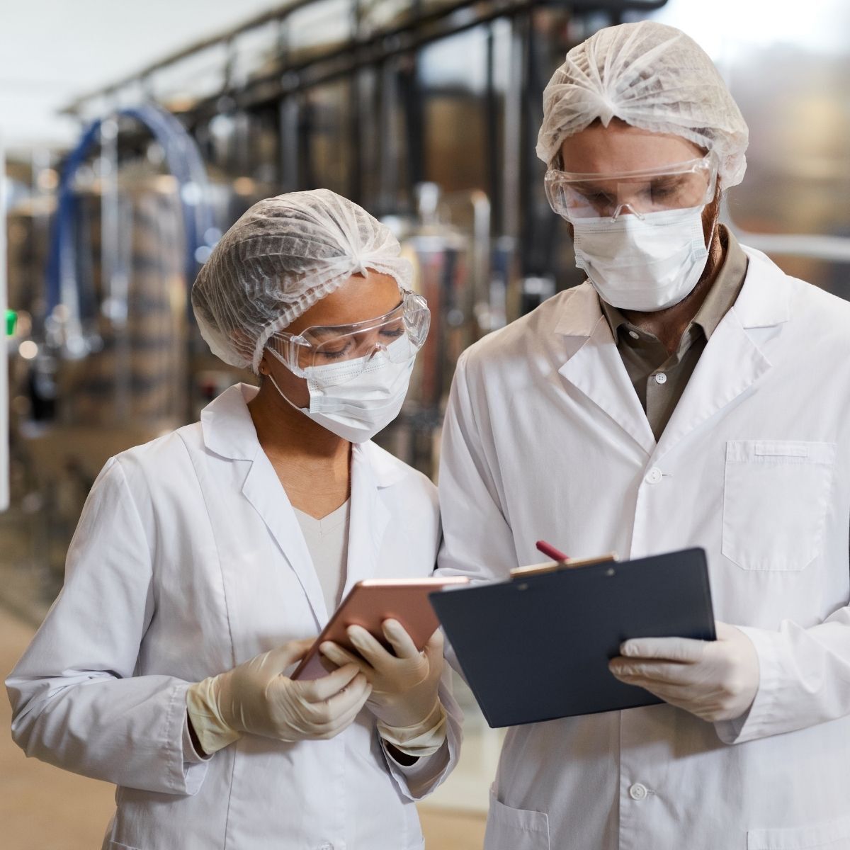 Cleanroom and Pharma Production Scientist Reviewing